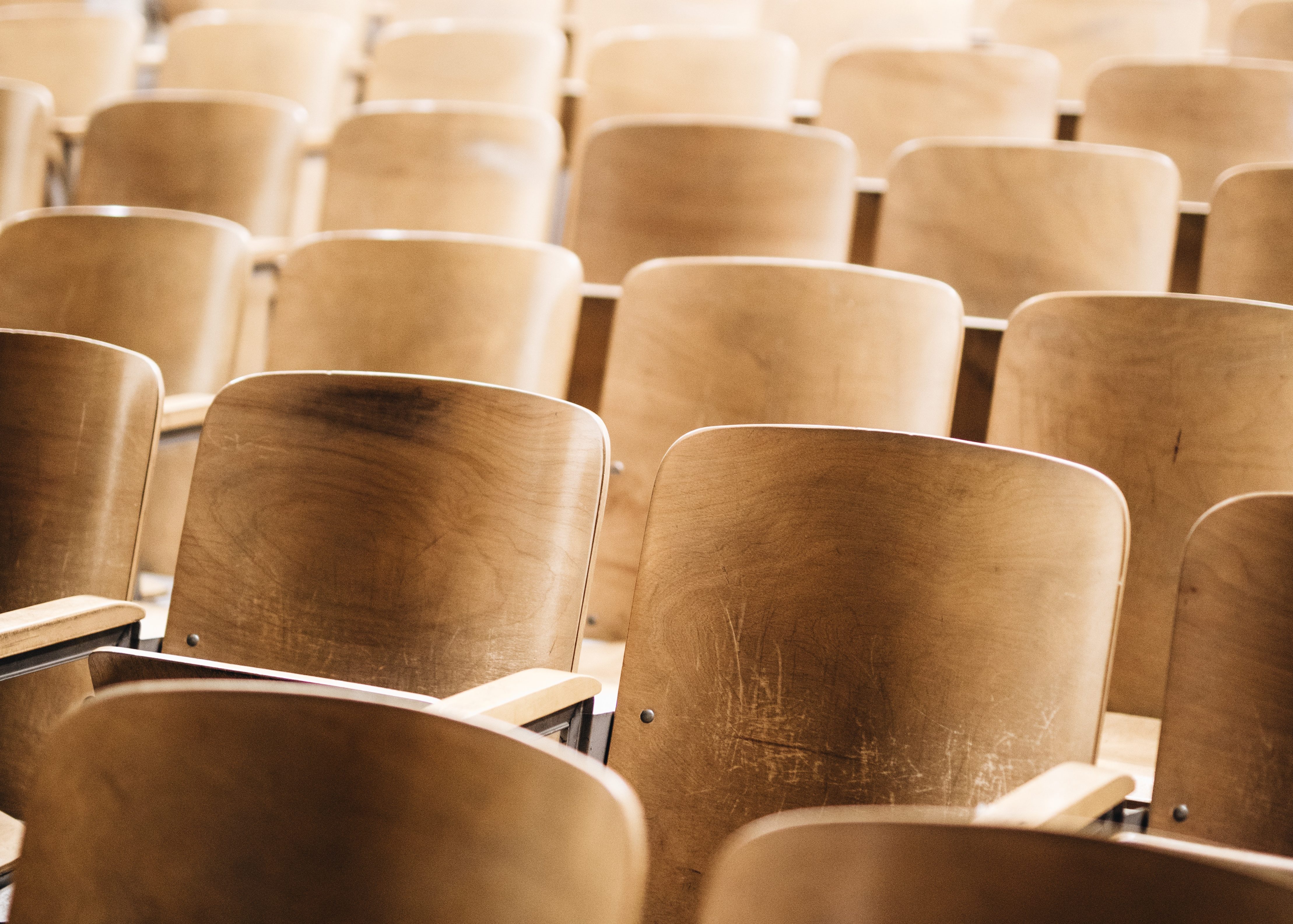 close-up shot of chairs in a college classroom