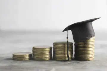 stacks of coins representing saving money for college education