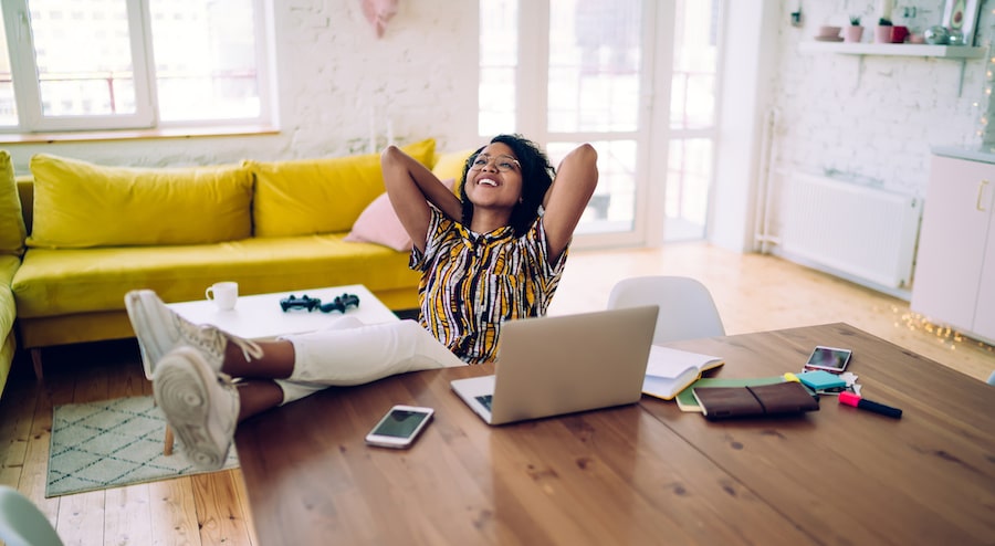 Woman feet up relaxing on the table Stock Photo